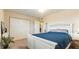 This bedroom features a large closet, neutral walls, and a comfortable bed for a relaxing retreat at 6100 Gulfport S Blvd # 415, Gulfport, FL 33707