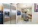 A view from the kitchen showcasing stainless steel refrigerator and eat-in dining area at 6100 Gulfport S Blvd # 415, Gulfport, FL 33707