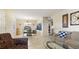 Open-concept living area showcasing tile floors, dining area, and comfortable seating, offering a bright and welcoming atmosphere at 6100 Gulfport S Blvd # 415, Gulfport, FL 33707