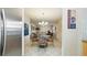 Open concept living room and dining area with tile floors and natural light at 6100 Gulfport S Blvd # 415, Gulfport, FL 33707