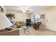 Comfortable living room featuring tile floors, a ceiling fan, and natural lighting at 6100 Gulfport S Blvd # 415, Gulfport, FL 33707