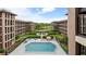Building with pool and outdoor recreation area, complete with seating and lush greenery at 6100 Gulfport S Blvd # 415, Gulfport, FL 33707