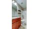 Bathroom featuring a shower-tub combo, dark floating shelves, and a sink with granite counters at 6145 103Rd N Ave, Pinellas Park, FL 33782