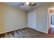 This bedroom features neutral walls, soft carpeting, and a closet with white bi-fold doors at 6145 103Rd N Ave, Pinellas Park, FL 33782
