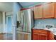 Kitchen with stainless steel refrigerator and beautiful marble countertops at 6145 103Rd N Ave, Pinellas Park, FL 33782