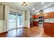 Bright kitchen with stainless appliances, wood cabinets, and patio access at 6145 103Rd N Ave, Pinellas Park, FL 33782