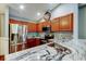 Granite countertops and stainless steel appliances highlight this kitchen at 6145 103Rd N Ave, Pinellas Park, FL 33782
