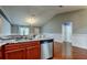 Open kitchen with marble countertops and wood floors, and stainless dishwasher at 6145 103Rd N Ave, Pinellas Park, FL 33782