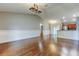 Open living space flows seamlessly into the kitchen with bar and hardwood flooring at 6145 103Rd N Ave, Pinellas Park, FL 33782