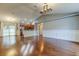 Open living room boasts hardwood floors and flows into kitchen and dining area at 6145 103Rd N Ave, Pinellas Park, FL 33782