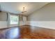 Bright living room features hardwood floors, crown molding, and modern lighting at 6145 103Rd N Ave, Pinellas Park, FL 33782