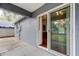 A patio with sliding glass doors lead into a kitchen, offering indoor-outdoor living at 6145 103Rd N Ave, Pinellas Park, FL 33782