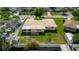 Aerial view of the home featuring a backyard, a shed, and a privacy fence at 6573 20Th N St, St Petersburg, FL 33702