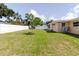 Spacious backyard with a lawn and a newly installed privacy fence at 6573 20Th N St, St Petersburg, FL 33702