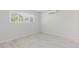 Bright bedroom with a window and stylish flooring, and mini split air conditioner at 6573 20Th N St, St Petersburg, FL 33702