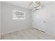 Bedroom featuring wood-look floors, a closet with sliding doors, a ceiling fan, and natural light at 6573 20Th N St, St Petersburg, FL 33702