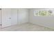 Bedroom featuring modern flooring, and closet space with bright window light at 6573 20Th N St, St Petersburg, FL 33702