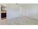 Bedroom featuring modern flooring and closet space, and a view to a bath at 6573 20Th N St, St Petersburg, FL 33702