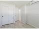 Bedroom featuring a closet, fresh white paint, wood-look floors, and bright natural light at 6573 20Th N St, St Petersburg, FL 33702