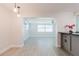 Open dining room features light-colored floors and modern lighting at 6573 20Th N St, St Petersburg, FL 33702