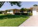 Desirable home displays manicured lawn, flowering landscape beds and convenient front driveway at 6573 20Th N St, St Petersburg, FL 33702