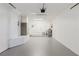 Large garage with epoxy flooring, a utility sink, and bright lighting, perfect for parking and projects at 6573 20Th N St, St Petersburg, FL 33702