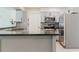 Bright kitchen features stainless appliances and granite countertops at 6573 20Th N St, St Petersburg, FL 33702
