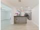 Open kitchen featuring stainless appliances, granite countertop and modern cabinets at 6573 20Th N St, St Petersburg, FL 33702