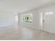 Inviting living room features light-colored floors and plenty of natural light at 6573 20Th N St, St Petersburg, FL 33702