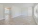 Spacious living room with light-colored floors and neutral paint throughout at 6573 20Th N St, St Petersburg, FL 33702