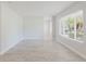 Open living room features light-colored floors and neutral walls at 6573 20Th N St, St Petersburg, FL 33702