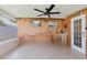 Nautical themed patio with a ceiling fan, a wet bar, and views of the yard at 6573 20Th N St, St Petersburg, FL 33702