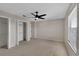 Bedroom featuring a ceiling fan and closet space and plush carpet for a comfortable, functional retreat at 7732 Bulls Head Dr, Wesley Chapel, FL 33545