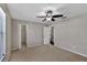 Bedroom featuring a ceiling fan, carpet, and closet, creating a comfortable private retreat at 7732 Bulls Head Dr, Wesley Chapel, FL 33545