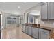 Open concept kitchen with stainless steel appliances, granite countertops, and a breakfast area at 7732 Bulls Head Dr, Wesley Chapel, FL 33545
