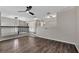 Loft area with wood-look flooring and contemporary lighting creates an open and airy space at 7732 Bulls Head Dr, Wesley Chapel, FL 33545