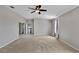 Bright and airy main bedroom with an ensuite bathroom and ample closet space at 7732 Bulls Head Dr, Wesley Chapel, FL 33545