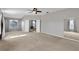 Expansive main bedroom features neutral carpet, ensuite bathroom and ample natural light at 7732 Bulls Head Dr, Wesley Chapel, FL 33545