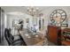 Bright office space featuring hardwood floors, detailed trim work, and french doors at 7732 Bulls Head Dr, Wesley Chapel, FL 33545