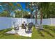 Relaxing backyard patio area with seating, fire pit, and a peaceful ambiance at 7818 Holiday Dr, Spring Hill, FL 34606