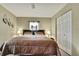 Comfortable bedroom featuring a cozy bed with lamps and a closet for ample storage at 7818 Holiday Dr, Spring Hill, FL 34606