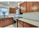 Close up of kitchen featuring an island, granite counters, and stainless appliances at 7818 Holiday Dr, Spring Hill, FL 34606