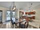 Bright eat-in kitchen with stainless steel appliances, an island, and French doors to the yard at 7818 Holiday Dr, Spring Hill, FL 34606