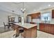 Kitchen featuring an island, granite counters, stainless appliances, and white subway tile backsplash at 7818 Holiday Dr, Spring Hill, FL 34606