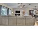 Large living room with hardwood floors and spacious sectional sofa at 7818 Holiday Dr, Spring Hill, FL 34606
