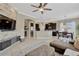 Open living space featuring a kitchen, dining area, and living room with stone accent wall at 7822 Atwood Dr, Wesley Chapel, FL 33545