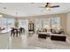 Open living space with dining area, comfortable seating, and bright natural light at 7822 Atwood Dr, Wesley Chapel, FL 33545