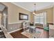 Versatile playroom with stylish decor, hardwood floors, and natural light for a fun and creative atmosphere at 7822 Atwood Dr, Wesley Chapel, FL 33545