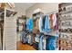 Walk-in closet with custom shelving, hanging racks, and storage at 7822 Atwood Dr, Wesley Chapel, FL 33545