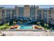 Aerial view of condo with pool and ocean access, highlighting prime waterfront location at 880 Mandalay Ave # N607, Clearwater Beach, FL 33767